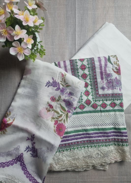 Set of embroidered fabric pieces on a wooden surface with flowers.