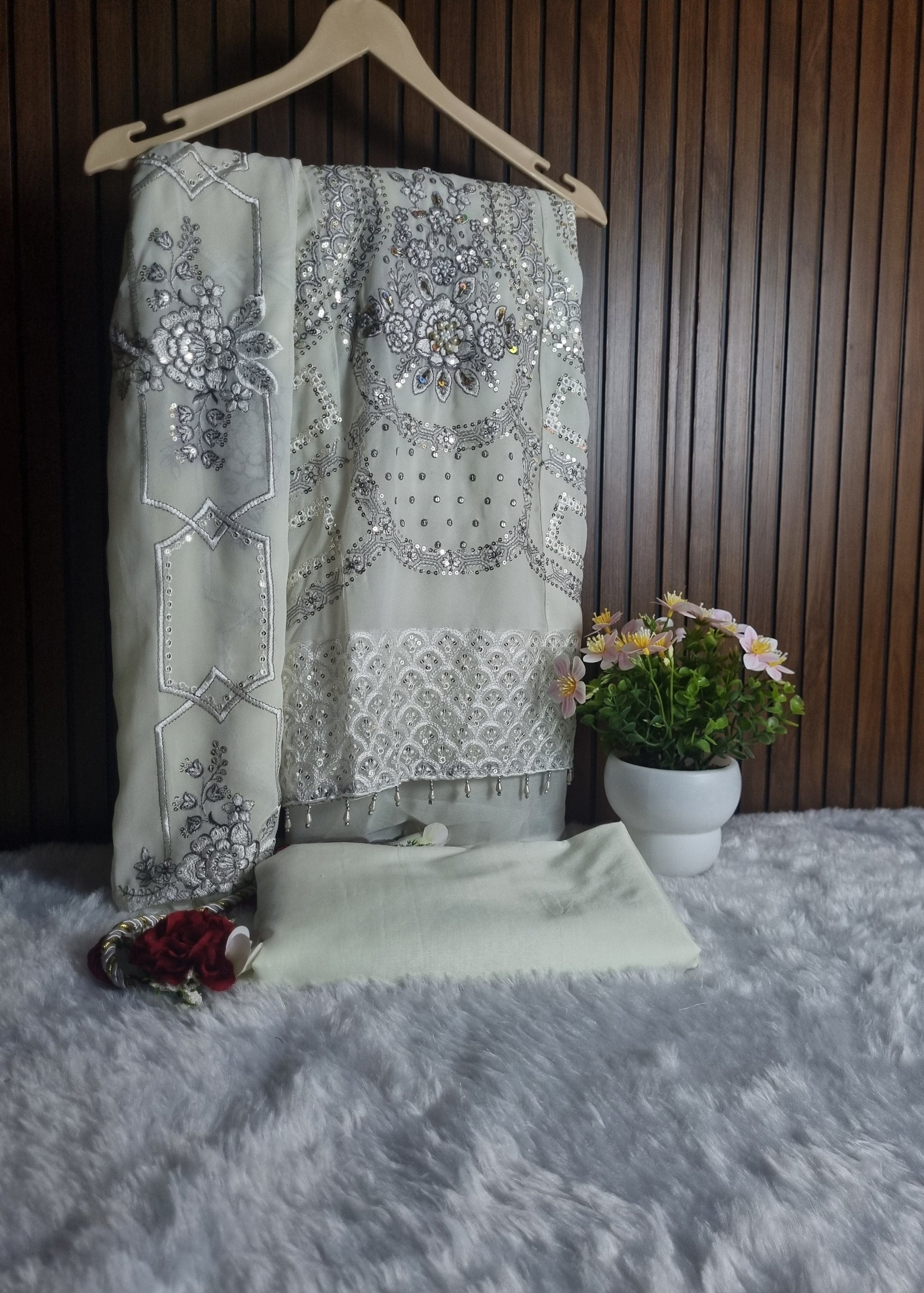 Decorative fabric with floral patterns on a wooden surface