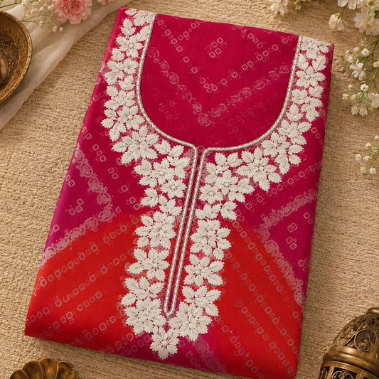 Bandhani suit set with orange pink tones, floral embroidery and decorative festive detailing for women