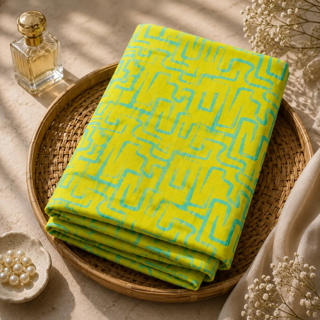Lime yellow suit fabric featuring turquoise geometric print and contemporary designer styling
