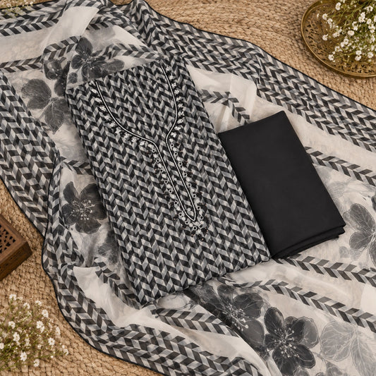Women's organza suit set featuring floral printed dupatta, geometric border detailing and sophisticated monochrome tones