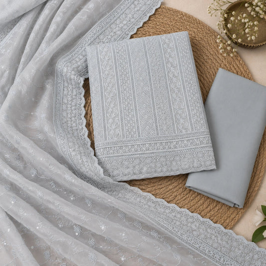 Premium icy grey Chikankari suit fabric with embellished neck design and festive ethnic wear styling