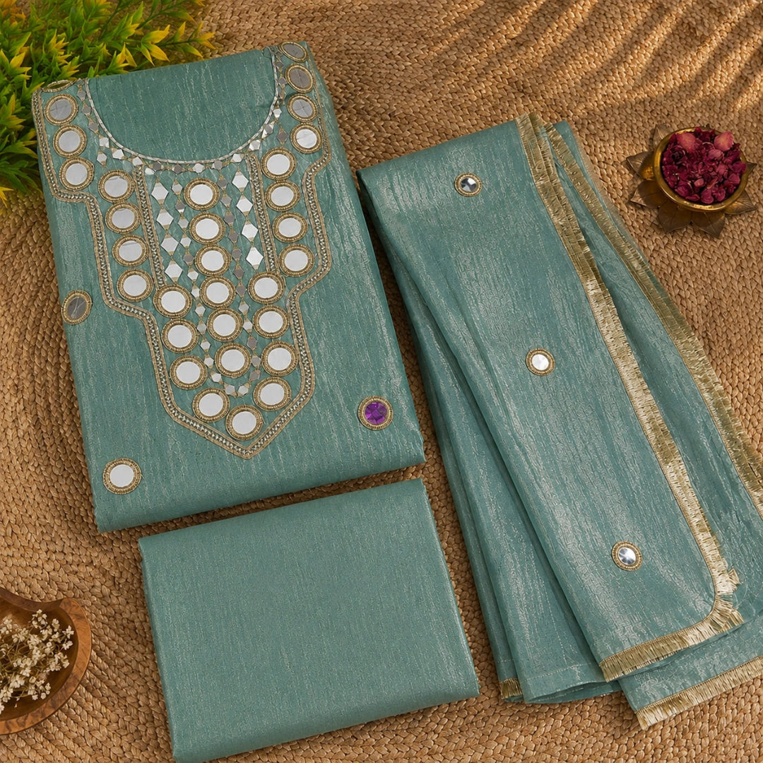 Mint green mirror embellished suit fabric with elegant shimmery texture and festive ethnic styling for women