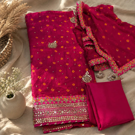 Traditional Fuchsia Pink Bandhani Gajji Silk suit set with golden embellishments, premium unstitched ethnic wear fabric for women