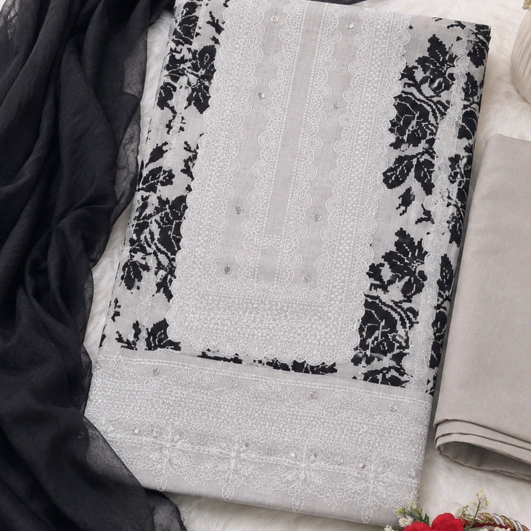 Grey floral printed suit fabric with black botanical motifs, mirror work detailing and matching ethnic wear appeal