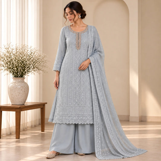Icy grey Chikankari inspired suit set with heavy embellished neckline, sequin embroidery, embroidered dupatta and premium unstitched suit fabric for women by Nityashree