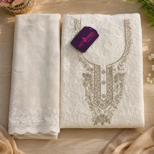 Pearl white floral Schiffli suit fabric with beadwork, golden accents and premium festive wear appeal