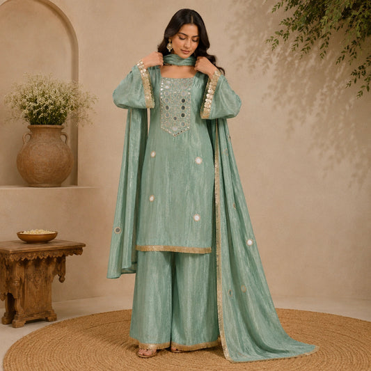 Soft mint green mirror work suit set with shimmery fabric, embellished neckline, matching palazzo and elegant dupatta for women by Nityashree