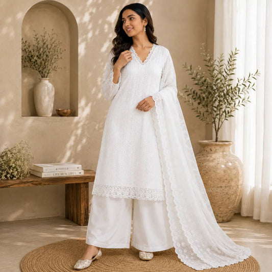 White Chikankari embroidered suit set with scalloped dupatta, intricate embroidery and premium unstitched suit fabric for women by Nityashree