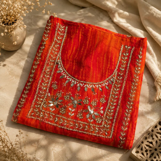 Orange festive suit set featuring floral embroidery, reflective embellishments and sheer designer dupatta with embellished motifs.