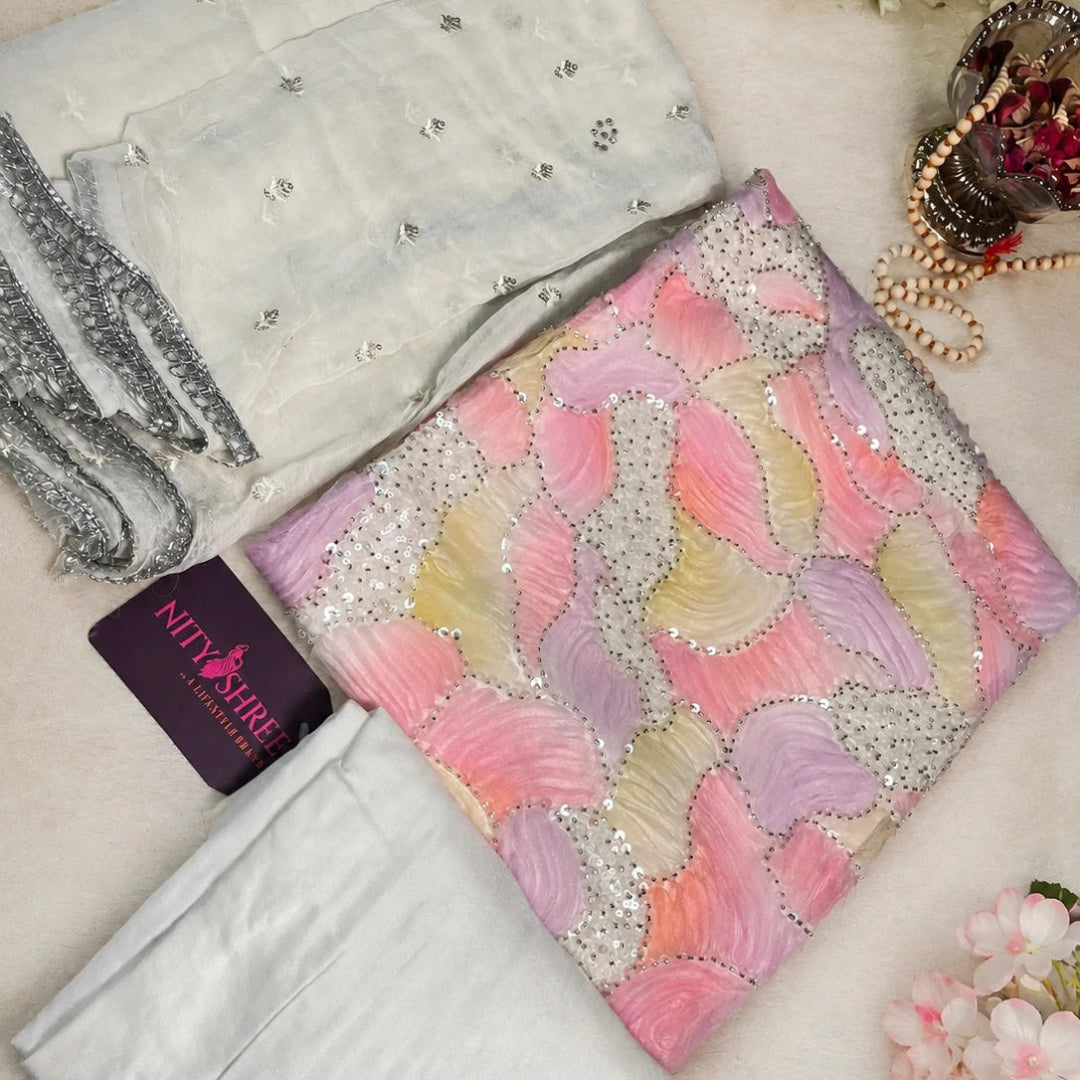 Pastel bloom georgette suit fabric with floral design, sequin embellishments and elegant festive wear styling