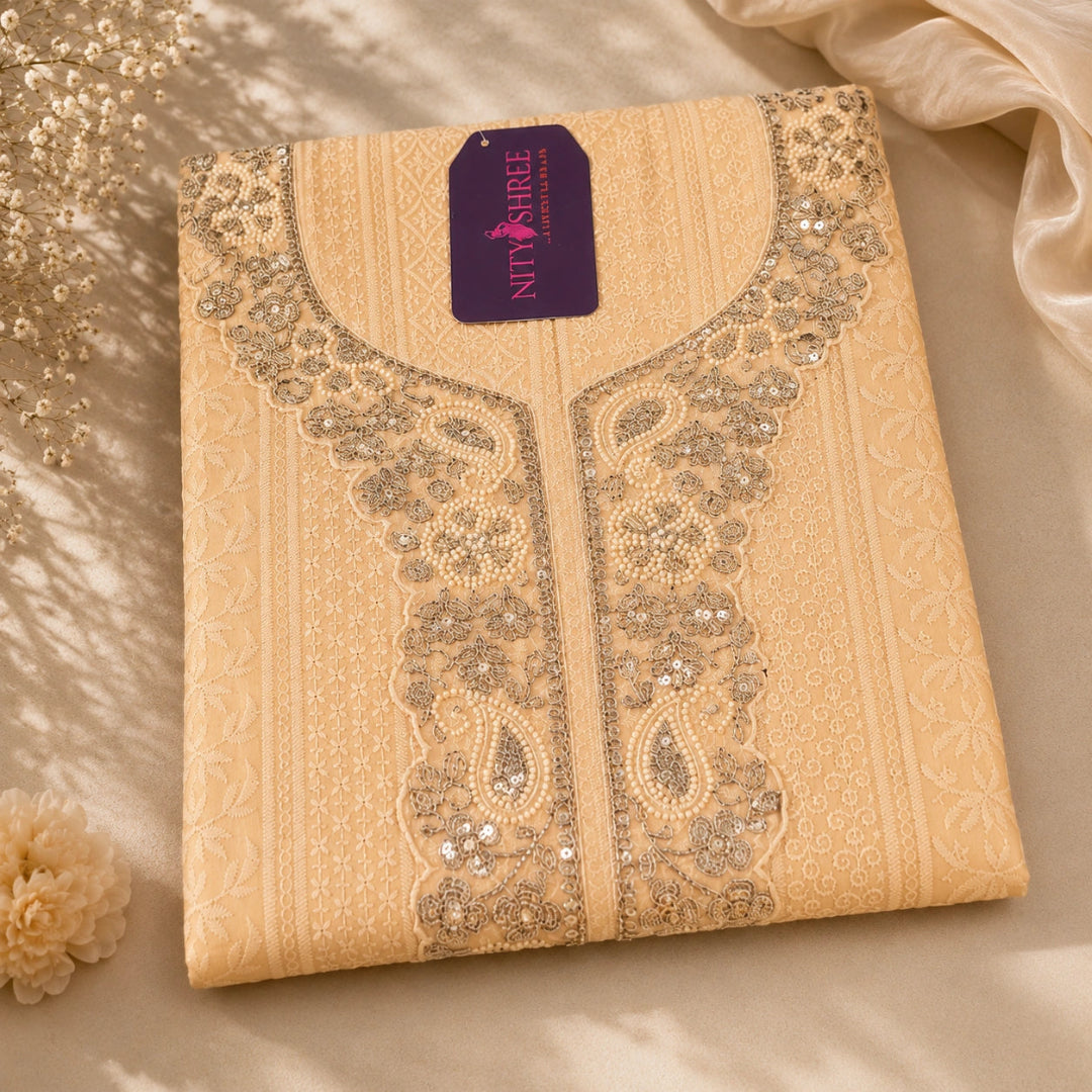 Peach beige embroidered suit fabric with Chikankari-inspired floral motifs, zari detailing