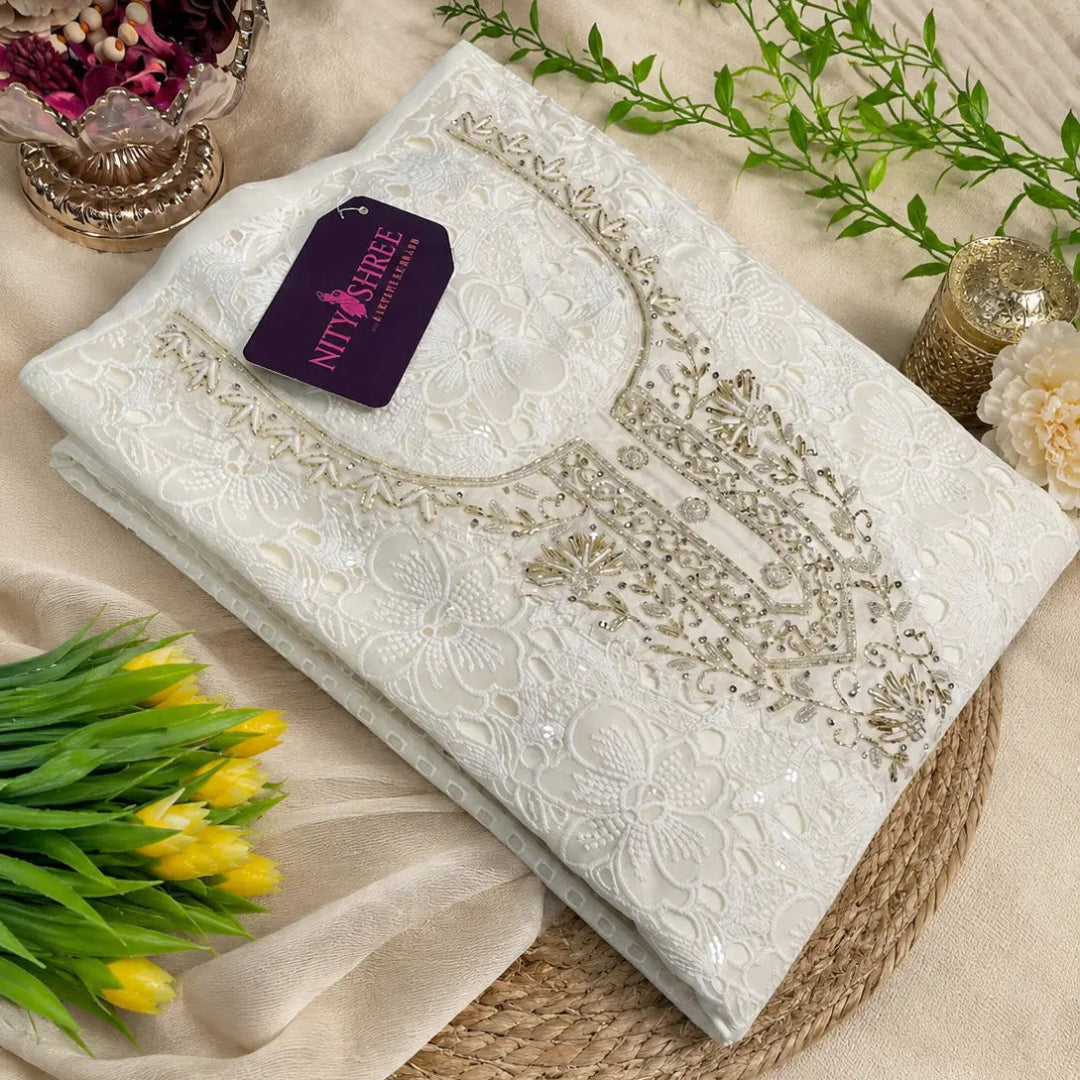 Pearl white Schiffli embroidered suit set with intricate hand embellishments, sequins and elegant floral embroidery