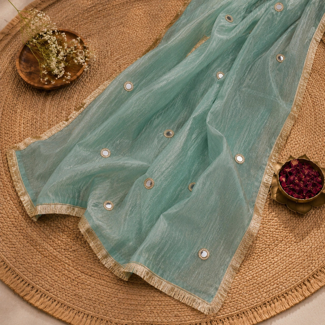 Mint green ethnic suit fabric featuring mirror work neck panel, shimmery dupatta and premium festive wear appeal