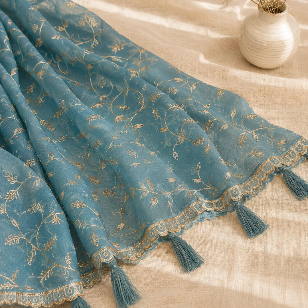 Contemporary steel blue suit material with golden bootis and floral embroidery