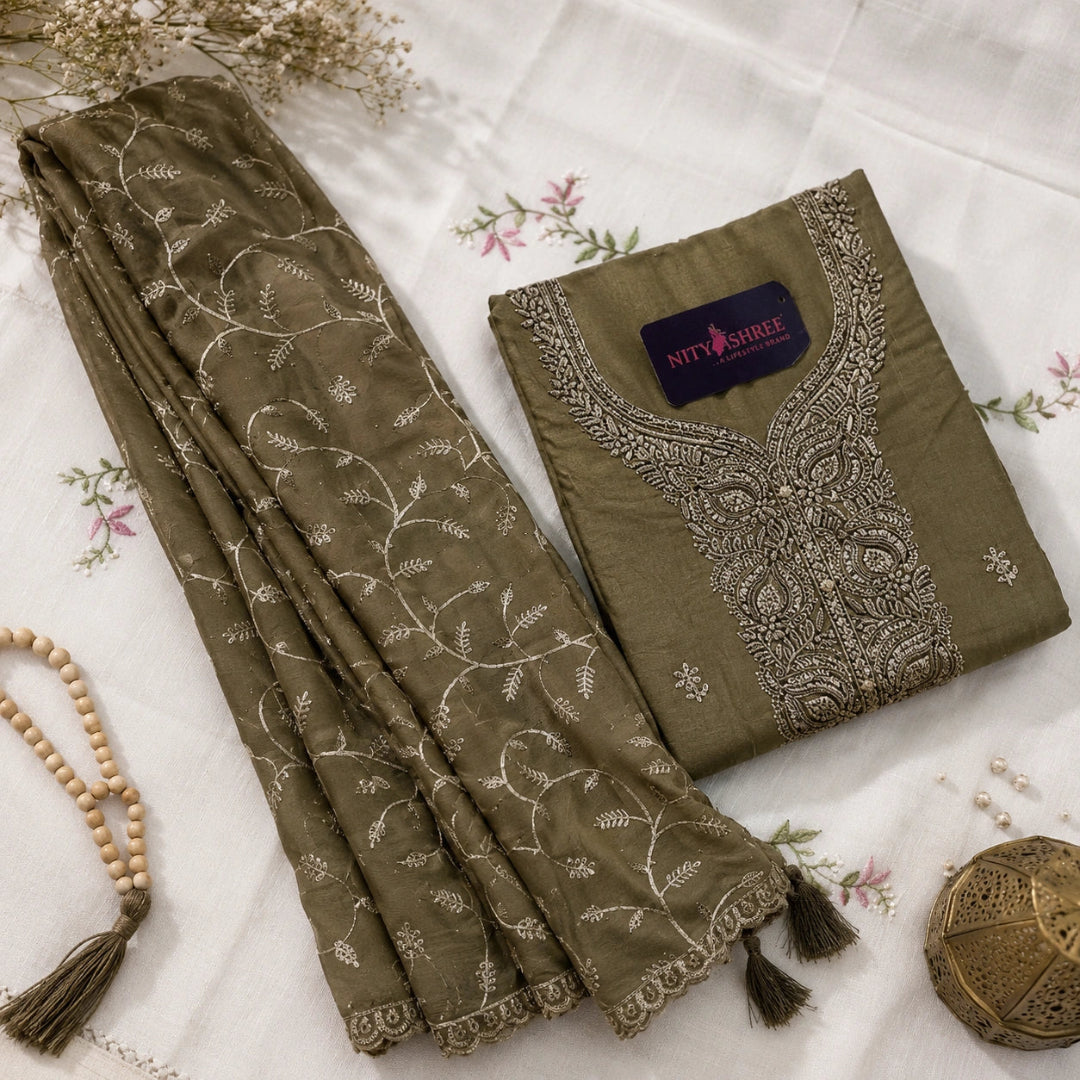 Steel grey unstitched suit set with golden booti motifs, floral gold embroidery and premium ethnic wear fabric for women by Nityashree