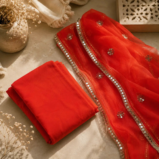 Premium sunset orange ethnic wear suit with embroidered, mirror work and decorative dupatta border.