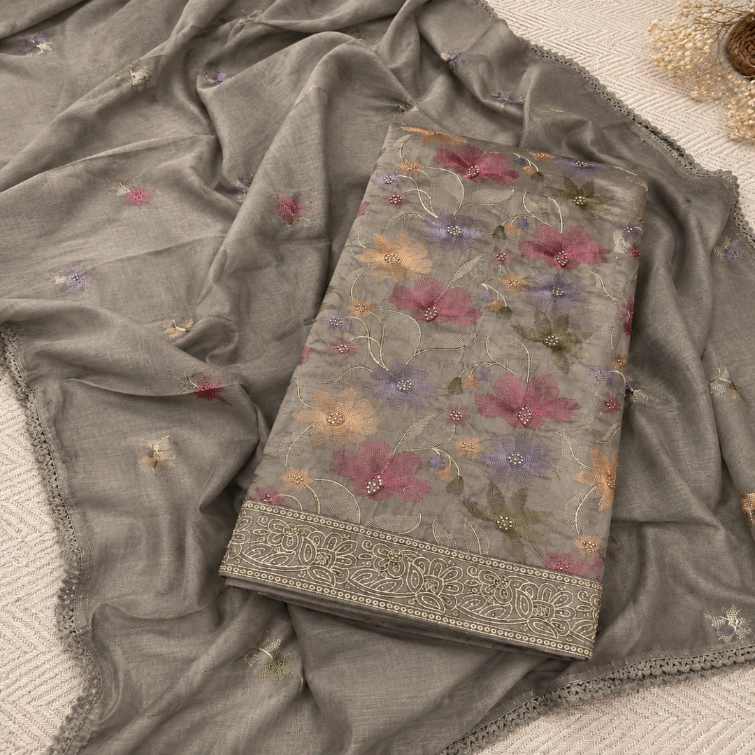 Taupe grey embroidered cotton suit fabric featuring floral motifs, decorative border and elegant dupatta