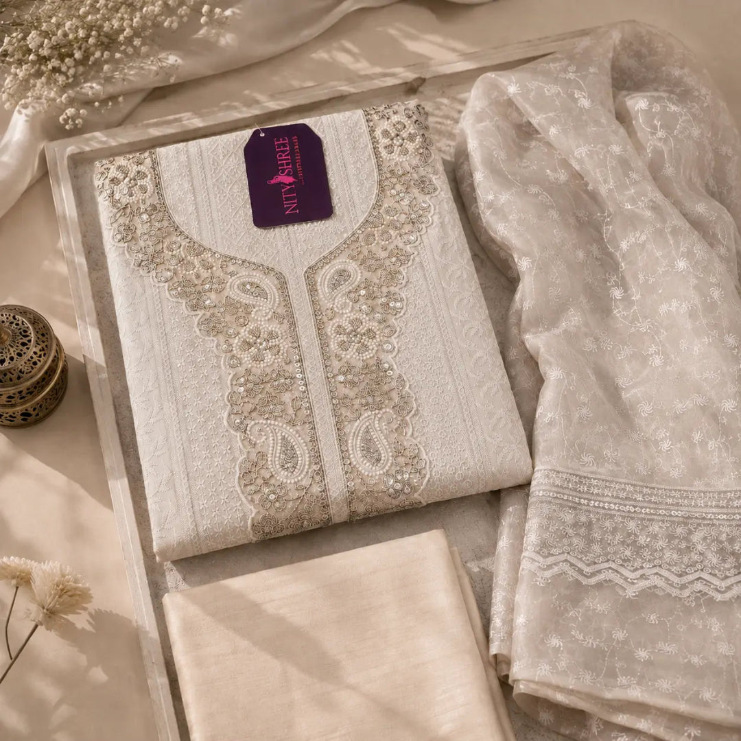 Soft taupe beige embroidered suit fabric featuring Chikankari-inspired embroidery, sequin embellishments and detailed border dupatta
