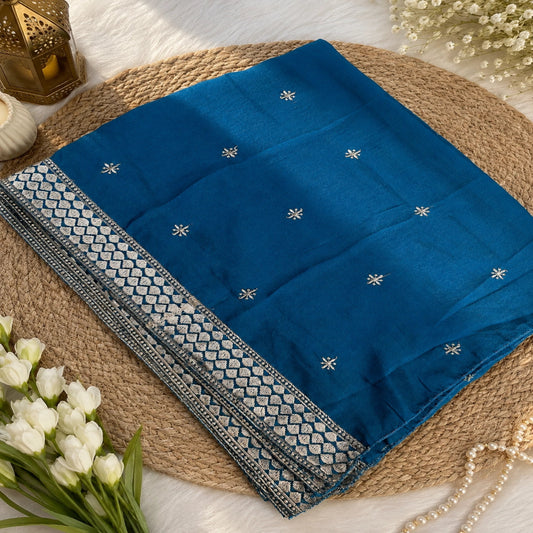 Aqua teal unstitched suit set featuring metallic embroidery, floral border detailing and elegant teal dupatta with decorative border