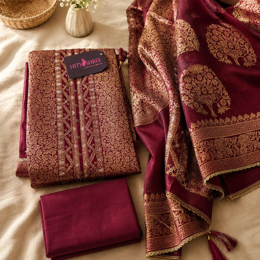 Wine floral brocadet with rich zari detailing, decorative motifs and designer Dola Silk dupatta